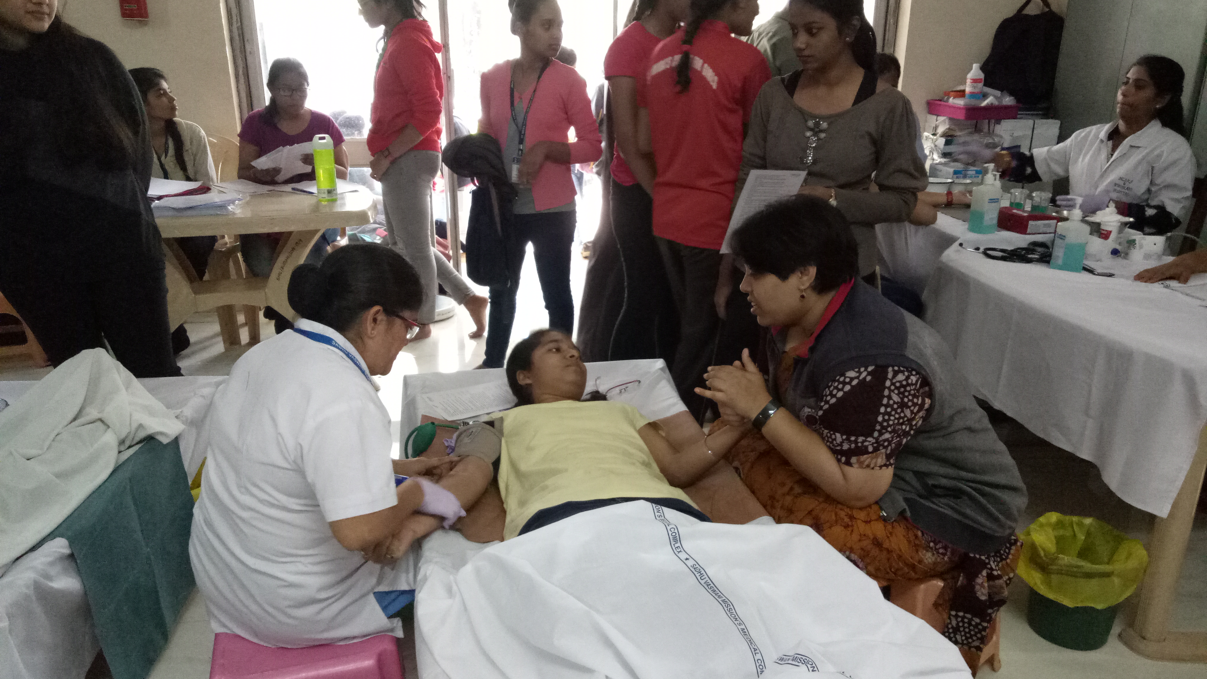 Ex-NSS PO making a donor comfortable blood donation camp