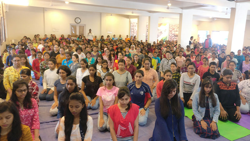 Students while performing Vajrasana