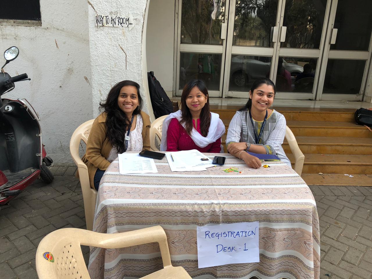 The registration desk welcoming the alumni